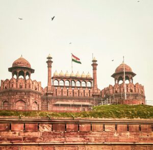 Historic Red Fort in New Delhi showcasing stunning Mughal architecture and the Indian flag.